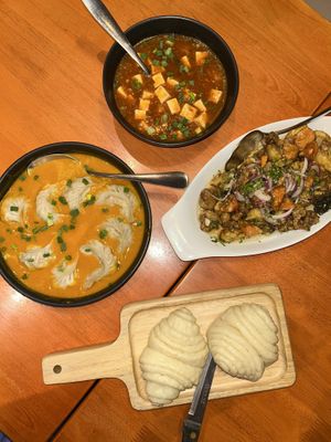 Jhol momos (soup dumplings), Mala tofu, crispy tangy vegetables, tingmo (steamed bread)   at Tibet Kitchen - ทิเบต คิทเช่น กรุงเทพมหานคร in Bangkok