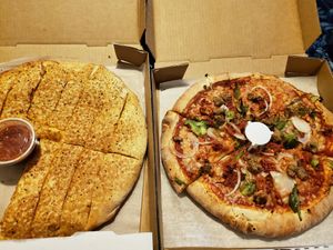 Figaro pizza with light cheese and cheese bread at The Pie in South Jordan