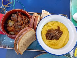 Left: "Briam" (stewed vegetables) and on the right side - fava beans with onions and "German style" rye bread. at Sokaki Cafe in Nafplion