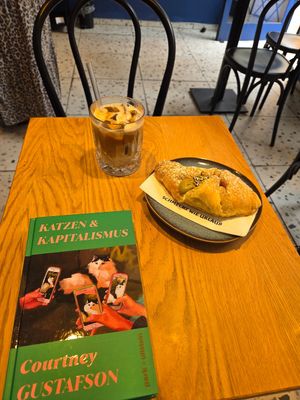 Pistachio croissant and iced coffee at Grey Kaffee in Vienna