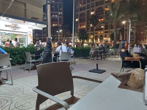 Outdoor seating area by the promenade at Heladeria Antiu Xixona in Cullera