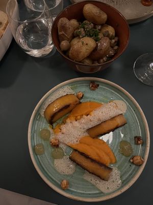 Main dish with a side of potatoes with mushrooms (included in the vegan menu)  at HEBE  in Paris