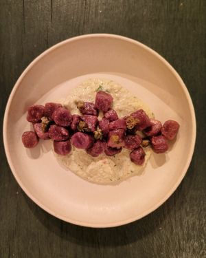 Beetroot gnocchi, lemon and herbs pesto, crunchy cappers at il Brucaliffo Cucina in Castiglione Dorcia