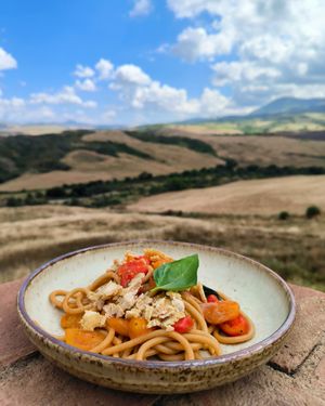 Pici with tomatoes and an homemade almond dried  ricotta at il Brucaliffo Cucina in Castiglione Dorcia