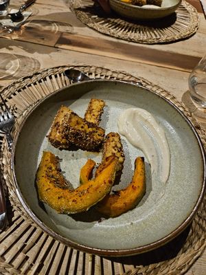 Chickpeas tempeh, pumpkin, sauce at il Brucaliffo Cucina in Castiglione Dorcia