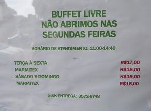 Hours of operation (open from 11:00 a.m. - 2:40 p.m.; closed Mondays; I believe "Marmitex" means lunch box, or takeout price) at Cheiro Verde in Foz Do Iguacu