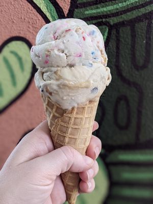 Plant Based Birthday Cake on top of Snickers in a waffle cone. at Plant Love Ice Cream  in Gulfport