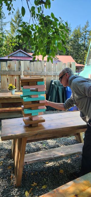 Enjoying giant jenga and sake cocktails for happy hour in the cute patio area at Hide N' Seek in Sooke