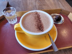 Hot chocolate with soy milk and a free piece of chocolate! at Laurent Gerbaud Chocolatier in Brussels