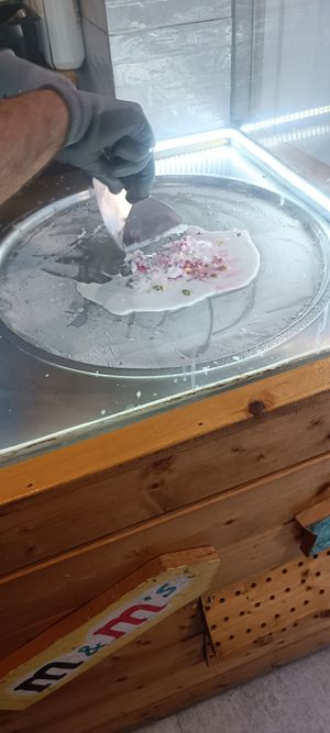 Coconut icecream with fresh raspberries and pistachios at Chop and Roll in Kos