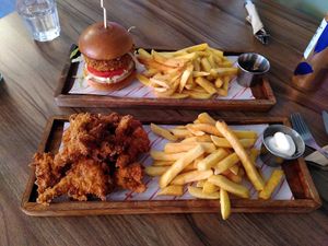 Top to bottom: chicken burger, oyster wings at Plant. Eat. Licious in Bath