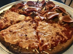 Pizza on gluten-free crust, half cheese for my partner/half sausage and pepperoni for me  at Antipasto's in Clifton Park