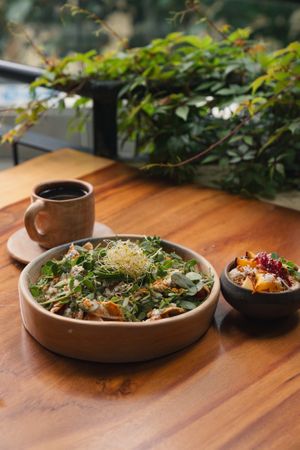 CHILAQUILES Y FRUTA FRESCA DE TEMPORADA  at Aguacate Veggie Bar in Oaxaca