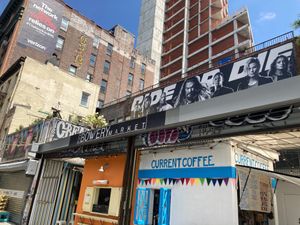 The Bowery Market (Sunday C&C is orange booth on the left) at Sunday C&C Eatery in New York City