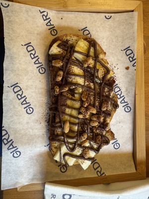 ‘Honestly good’ breakfast: Peanut & cocoa cream, toasted bread, banana.  at GIARDÍ  in Milan