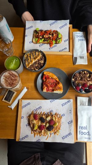 Focaccia, not-avocadk toast, yogurt bowls, peanut butter toast, latte and matcha at GIARDÍ  in Milan