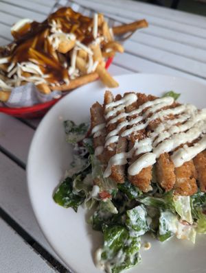 caesar in the foreground, poutine in the back at Mama B's in Chippendale