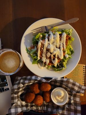 Chicken Caesar and pumpkin arancini balls with a 0% abv beer at Mama B's in Chippendale
