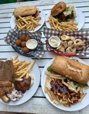 Steak sandwich, cauliflower burger, fried chick’n plate, salt and pepper kalamari, and pumpkin arancini fried   at Mama B's in Chippendale