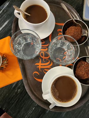 Coffee with oat milk on the side, Vegan arraksbollar at Latteria in Gothenburg