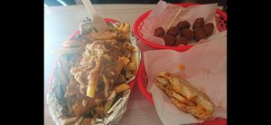 Large regular cut fries with poutine, Mac and cheese balls and chilli egg muffin. at Lord of the Fries in Fitzroy