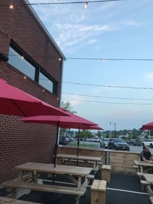 Outdoor seating area with cute lights  at Josies Pizza Bar in Glen Cove