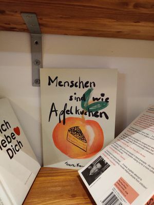 A bookshelf full of interesting literature at Coffea in Berlin