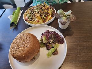Vegan cheesy nachos , vegan caramelized burger  at Plantoholic in Dubai