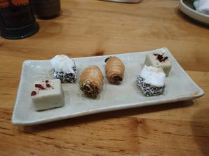 White chocolate with orange. Chocolate with coconot and pistachio filled pastry at Laurel in Budapest