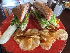 Cheeky Vegan. Very tasty sandwich. Had a mocha with oat milk too. Great weather today with a great view of Resurrection Bay.  at Zudy's Cafe in Seward