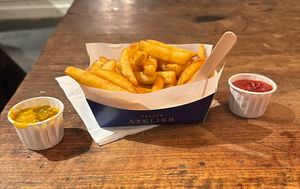 Fries with Piccadilly and ketchup sauces (the only two vegan sauces)  at Frites Atelier in Brussels