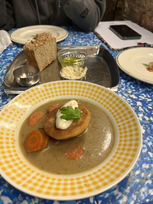 Zalewajka and bread with miso butter (partially eaten)  at bar mir in Warsaw