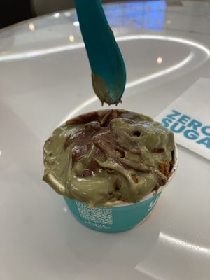 Chocolate ice cream with pistachio sauce and crushed caramelised biscuits   at Yolé Cafe - Chinatown in Central Singapore