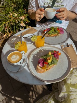 Vegan avocado toast, oat milk cappuccino & fresh orange juice
 at Pip Deli in Haarlem