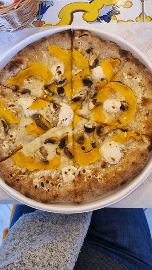 Vegan pizza with mushrooms, pumpkin, and vegan ricotta at Bottega di Rosaria in Siena