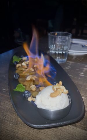 Flaming pineapple w ice cream dessert! #Veganuary at The Raven Room in Whistler