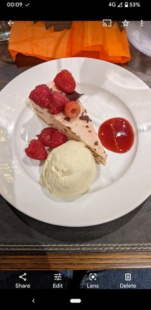 Christmas dessert offering Dec 2022 dark chocolate and raspberry cheesecake and vanilla ice cream at Cornkist in Ellon