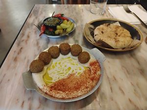 Hummus with pita, and chilies at Cult of Pita in Porto