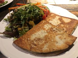 Vegan quesadilla bolognese with leafy greens at Radost Fina Kuhinjica in Belgrade