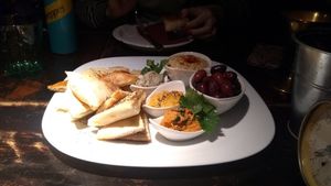 Starter with hummus, olives, pita bread, Baba ganoush and other two sauces at Radost Fina Kuhinjica in Belgrade