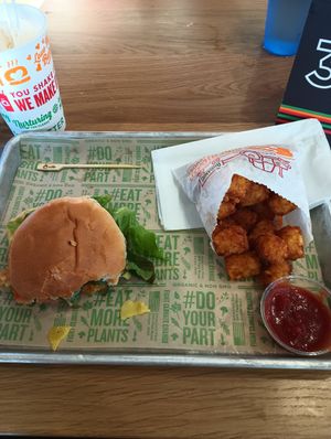 Half eaten fish sandwich at Next Level Clucker - Ballard in Seattle