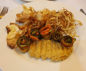 COURGETTE ROLLS WITH CHICKPEA HUMMUS ON A BED OF FRIED ONIONS AND CELERY CHIPS (grilled carrots) at Hotel Jezero in Plitvicka Jezera