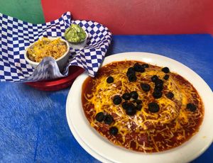NEW MEXICO STACKED CHEESE ENCHILADAS WITH RED HATCH CHILI ENCHILADA SAUCE, VEGAN RICE & BEANS, GUAC & SOUR CREAM at The Taco Shoppe in Government Camp