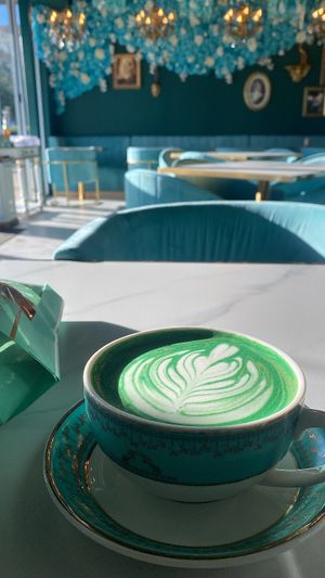 whichever special latte has chicory &hazelnut. good because it’s not super sweet! surprised it was green haha. and bagged off to the side, out of the pic is a plain croissant YUM at Unicorniverse Bakery & Cafe in Round Rock