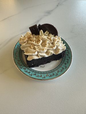 Chocolate peanut butter cake. It was amazing. Very dense and moist. Almost like fudge. Highly recommended   at Unicorniverse Bakery & Cafe in Round Rock