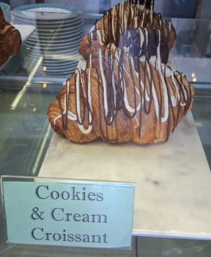 Giant croissant with cream filling mixed with crushed oreo cookies. at Unicorniverse Bakery & Cafe in Round Rock