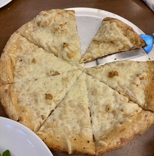 Medium garlic and Olive oil base with vegan cheesee  at Mellow Mushroom in Cary