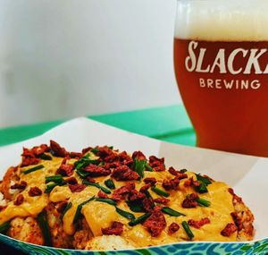 Vegan Loaded Tots with Credo Queso, Bac'n Bits, and chives. at Slackers Brewing Co in Austin