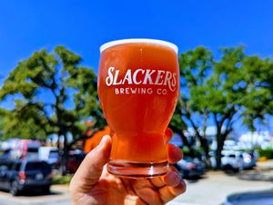 Pinkity Drinkity. Made with real fruit and the creaminess comes from flaked corn, not milk sugars. at Slackers Brewing Co in Austin