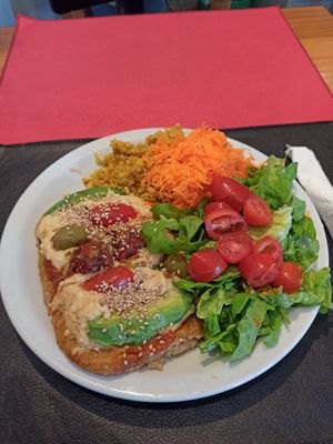 Vegan steak with vegan cheese, quinoa and salad at Vegetariana in Buenos Aires